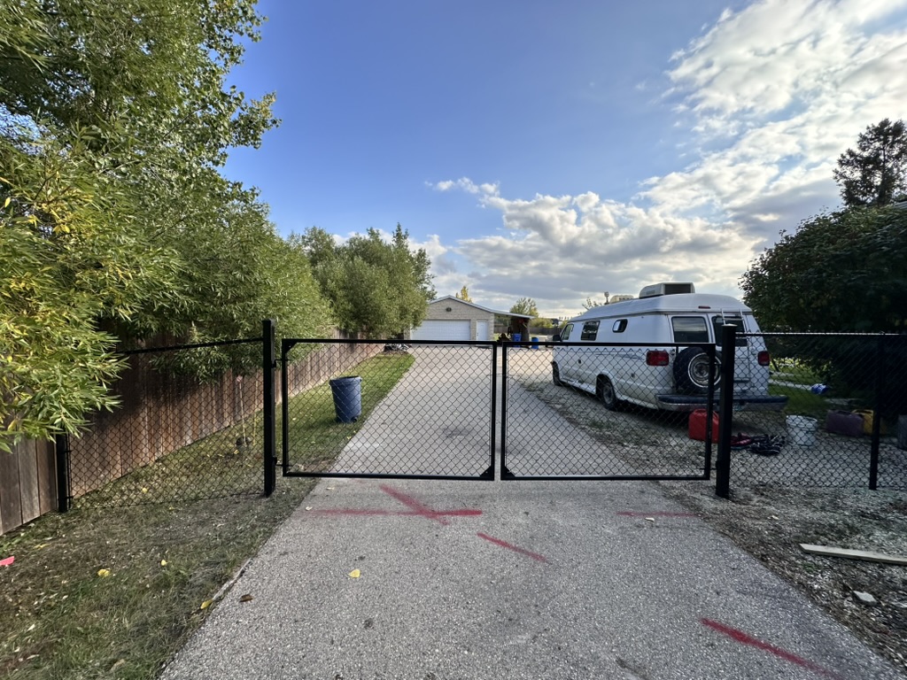 Custom chain link double swing gate with welded frame