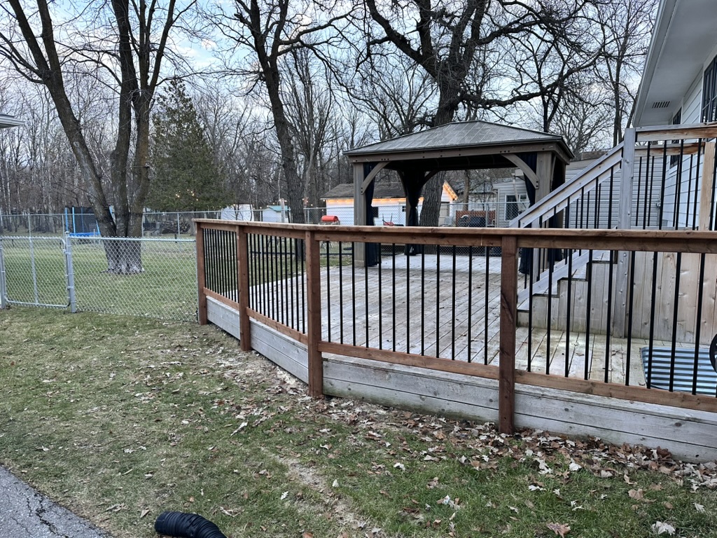 Galvanized fence with wood deck railing