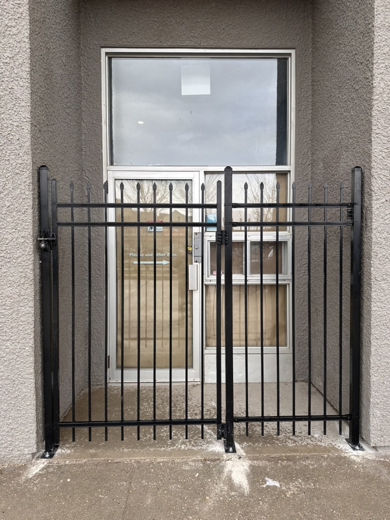 Classic black ornamental gate with spear-top pickets
