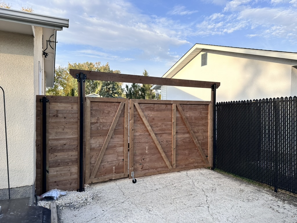 Wood double gate with metal posts for enclosure access